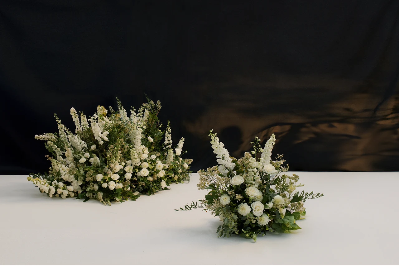 After retouching: clean floral composition against a dark backdrop