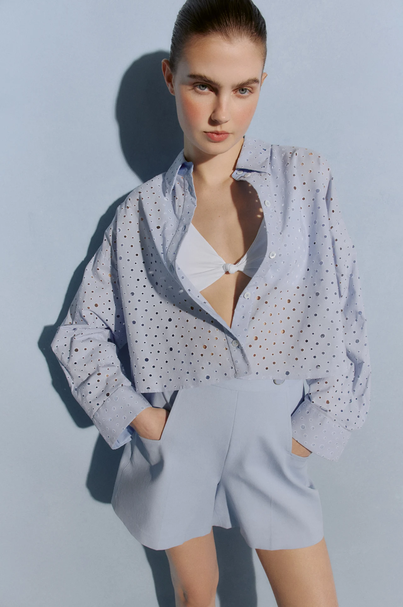 Model in a pale blue summer suit
